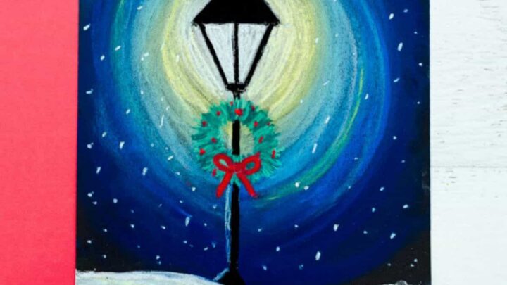 Chalk pastel lamppost art project for kids to make. Black street lamp with falling snow.