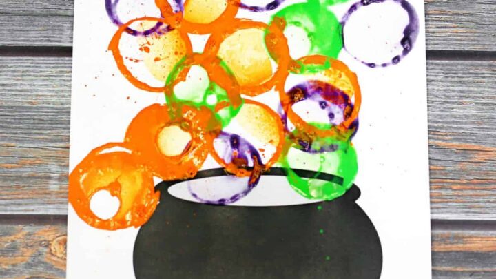 Witch's cauldron bubble painting Halloween art project with free printable cauldron template.