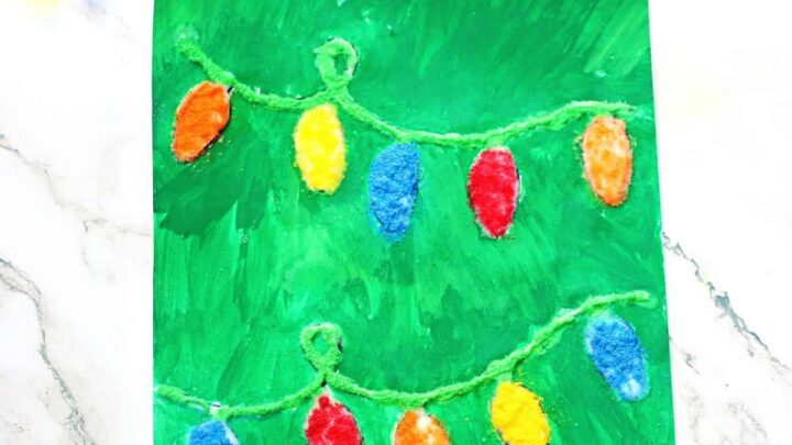 Christmas lights salt painting idea for kids using printable template and watercolor paint.